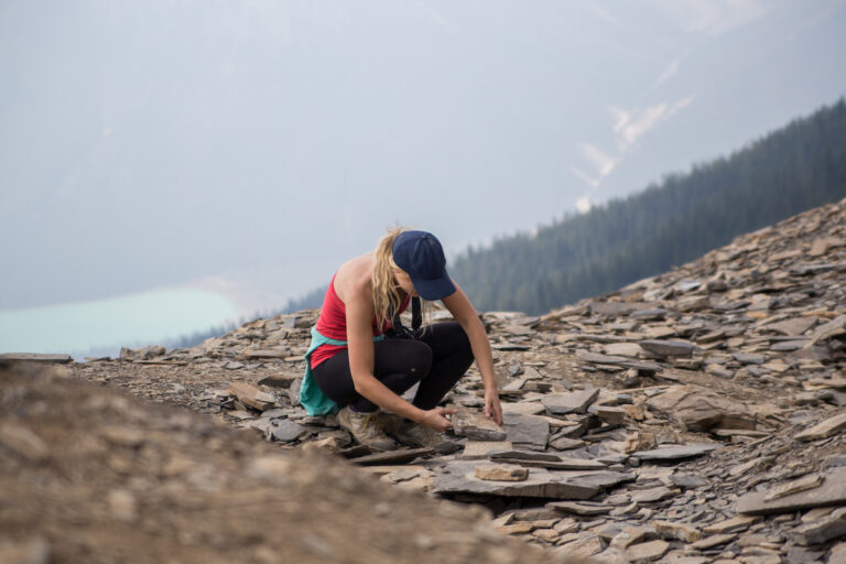 Fossil hunter turning over rocks at the Walcott Quarry Burgess Shale. Photo by Tyler Parker Photography